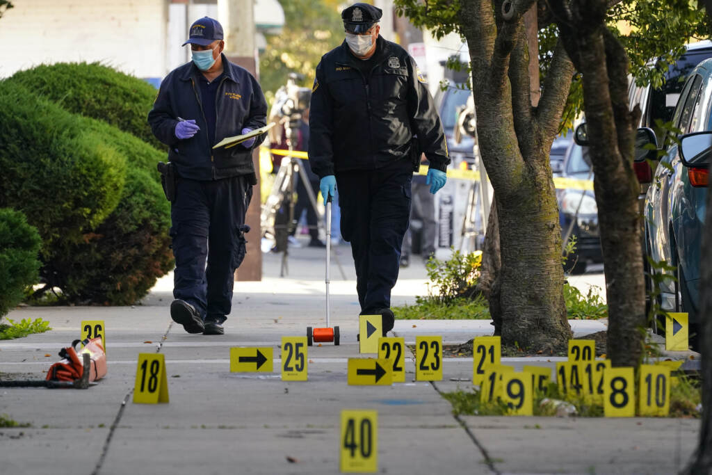 APTOPIX Officers Shot Philadelphia Investigators work the scene where multiple people were shot including police officers when a SWAT team attempted to serve a homicide warrant in Philadelphia, Wednesday, Oct. 12, 2022. (AP Photo/Matt Rourke)