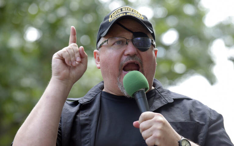 A man speaks into a microphone.