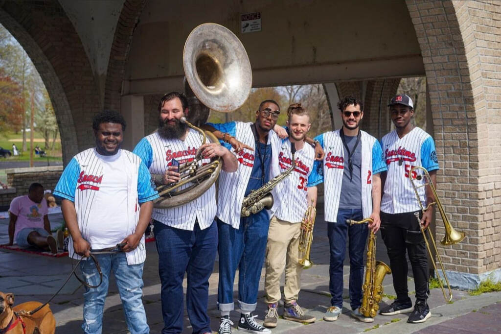 snacktime-dancing-on-my-own-phillies Members of the Philly band Snacktime pose with Phillies jerseys on, instruments in hand.