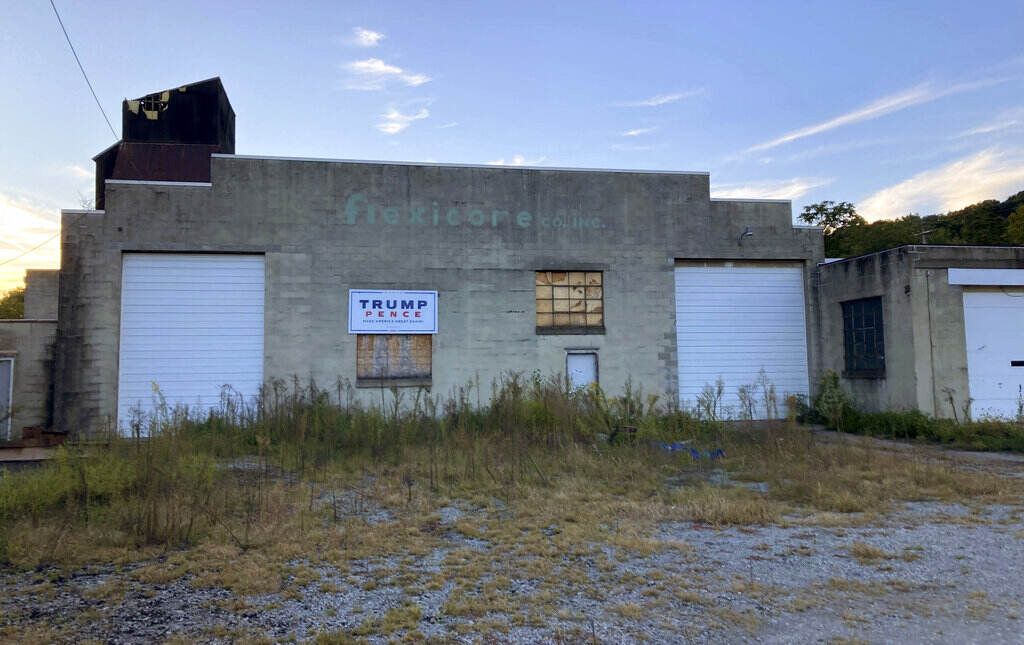 Election 2022 Pennsylvania Trump-Pence sign hangs on a building off of Main Street in Monongahela, Pa., on Sept. 23, 2022. The sign is a lasting vestige of the campaign fervor that roused voters to the polls, including many who still believe the falsehood that the former president didn’t lose the 2020 election and hope he will run again in 2024. (AP Photo/Lisa Mascaro)
