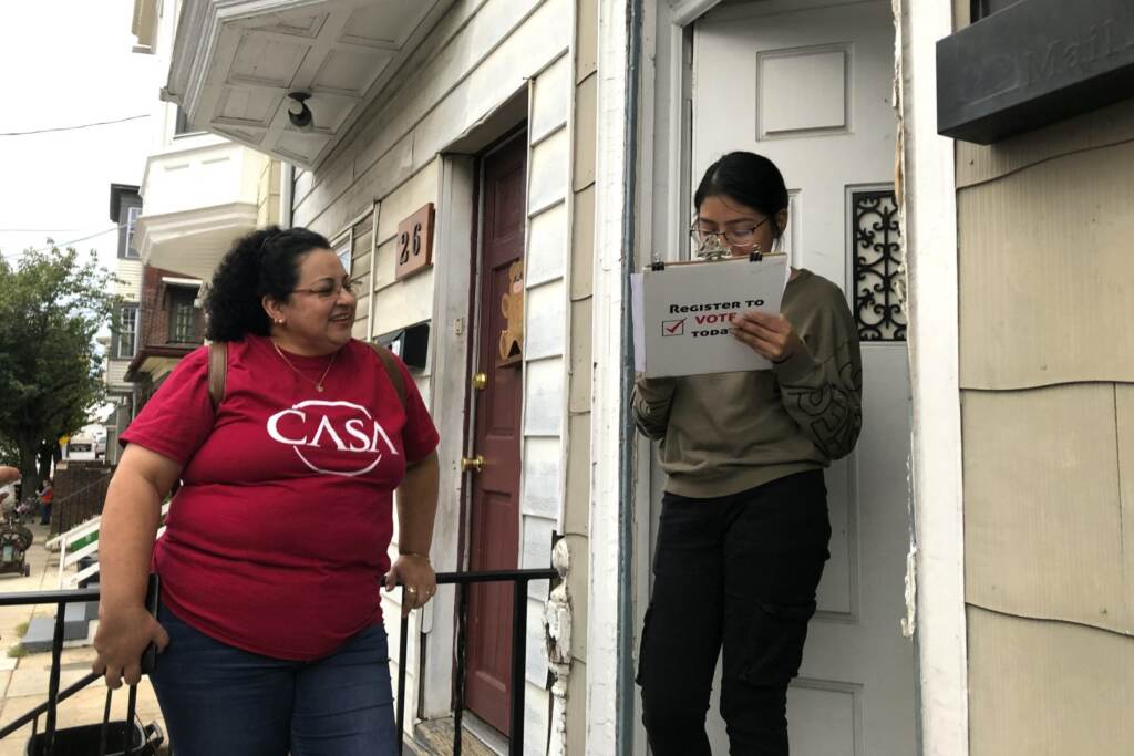 voter-outreach-york–1620×1080 Mirna Orellana, left, a community organizer from the non-profit group We Are Casa, helps Karyme Navarro, right, fill out a voter registration form in York, Pa., on Sept. 30, 2019. (Will Weissert / AP Photo)