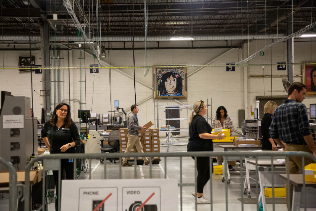 Ballout counters work together to make sure all the mail-in ballots are scanned through properly at the Philadelphia County Ballot Processing Center  on November 8th 2022. Emily Cohen For WHYY
