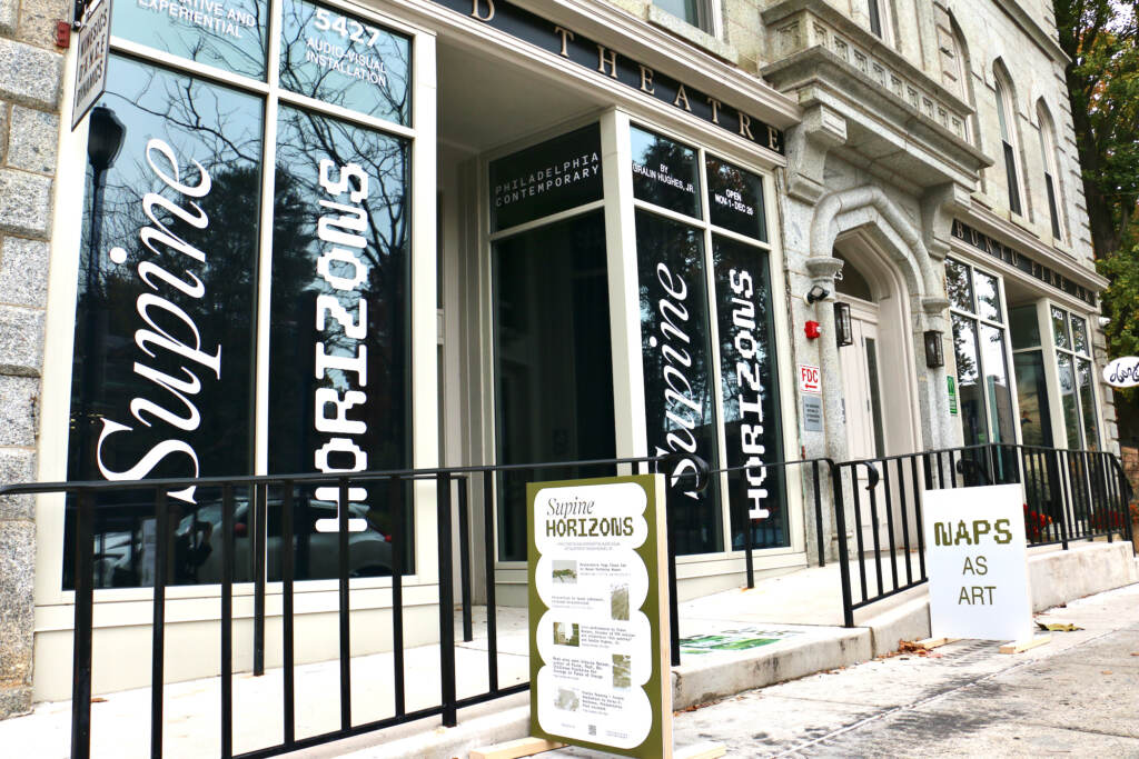 A sign reads, "Naps as Art" outside of a building.