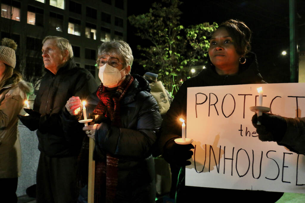 2022 11 16-e lee-norristown pa montgomery county courthouse-homeless night candles A group of people hold candles, with one person holding a sign that reads,