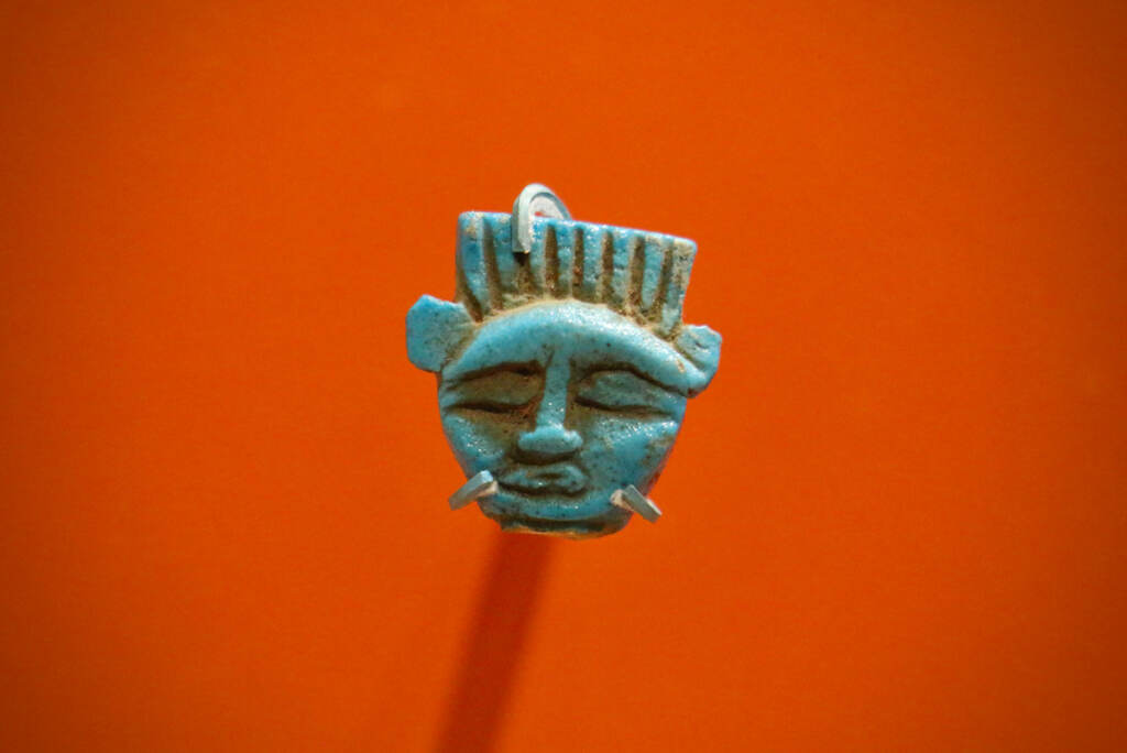 An image of a goddess is visible against an orange background.