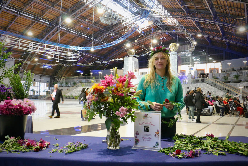 2022 11 18-e lee-jackie small-philadelphia pennsylvania convention center-2023 flower show Jackie Small of Philly DIY Wedding creates flower wreaths at the Philadelphia Flower Show announcement. Small will be one of the vendors when the show returns to the Pennsylvania Convention Center in March of 2023. (Emma Lee/WHYY)