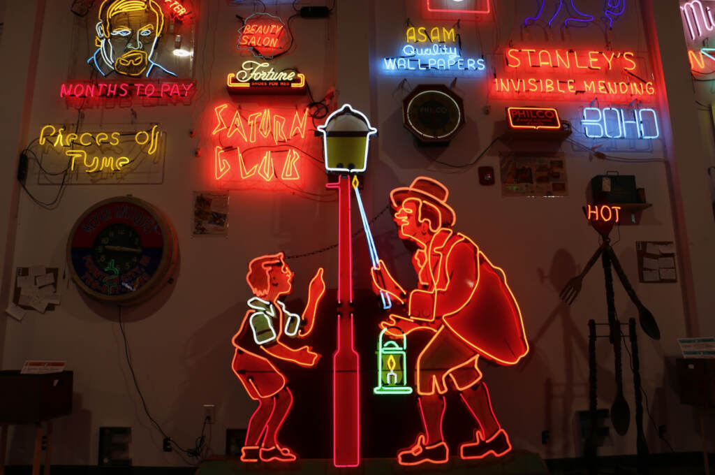 Big, bright neon signs are seen on display at an art exhibit