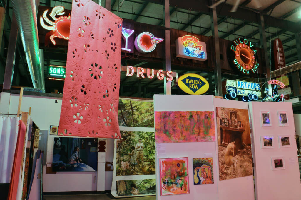 Big, bright neon signs are seen on display at an art exhibit