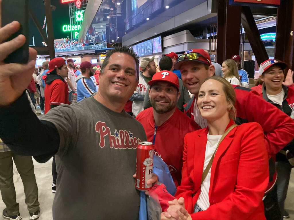 World Series Hoskins Beer Run Baseball Jayme Hoskins, right, wife of Philadelphia Phillies first baseman Rhys Hoskins, poses with fans at Game 4 of the baseball World Series between the Phillies and the Houston Astros on Wednesday. Nov. 2, 2022, in Philadelphia. Hoskins tweeted she would buy fans beer before the game at Section 104 of the stadium. She paid for about 100 beers. (AP Photo/Daniel Gelston)