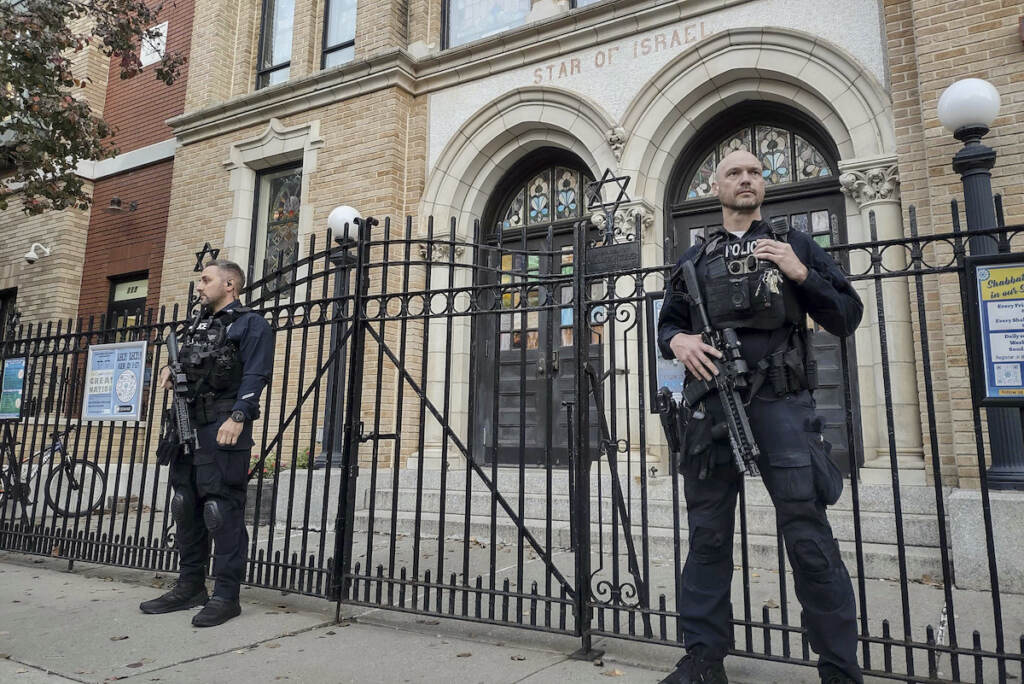 Synagogue Threats New Jersey Hoboken Police officers stand watch outside the United Synagogue of Hoboken, Thursday, Nov. 3, 2022, in Hoboken, N.J. The FBI says it has received credible information about a threat to synagogues in New Jersey. The FBI's Newark office released a statement Thursday afternoon that characterizes it as a broad threat. The statement urged synagogues to