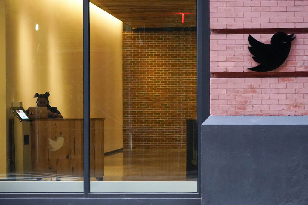 Musk Twitter FILE - A receptionist works in the lobby of the building that houses the Twitter office in New York, Wednesday, Oct. 26, 2022. Elon Musk has emailed Twitter employees ordering them to return to the office starting Thursday for at least 40 hours a week and warning of “difficult times ahead.” (AP Photo/Mary Altaffer)