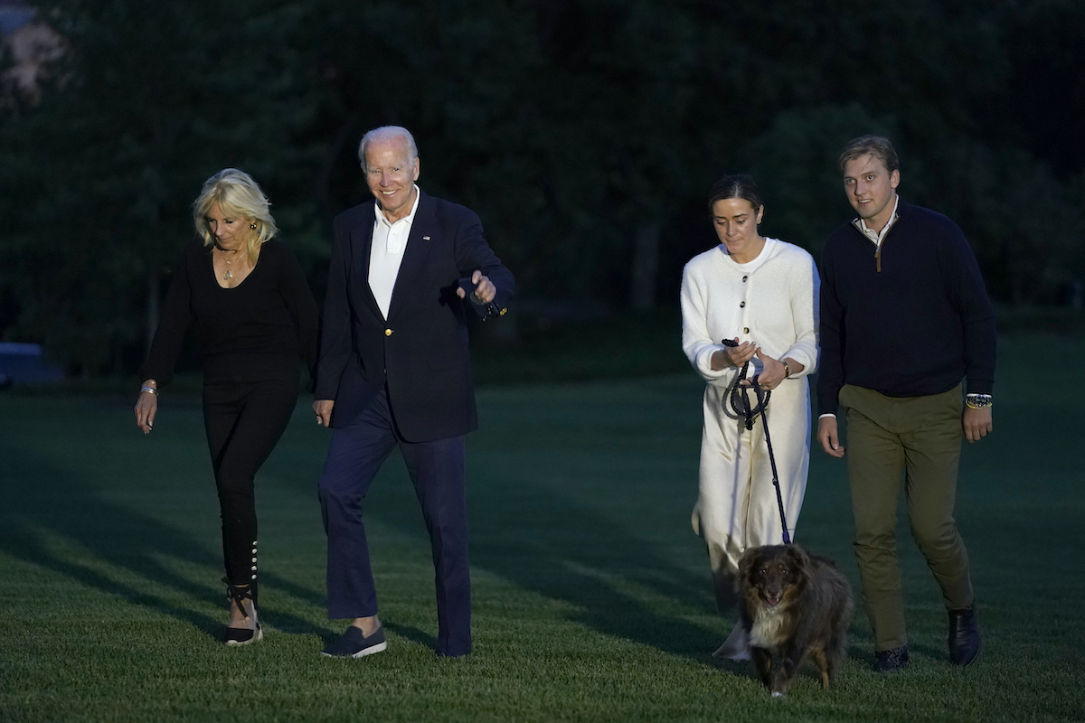 White House Weddings Biden File photo: President Joe Biden and fist lady Jill Biden, left, walk with their granddaughter Naomi Biden, second from right, and her fiancé Peter Neal, right, and Neal's dog Charlie, across the South Lawn of the White House in Washington, June 20, 2022, as they return from a weekend at the Biden's beach home in Delaware. (AP Photo/Susan Walsh, File)