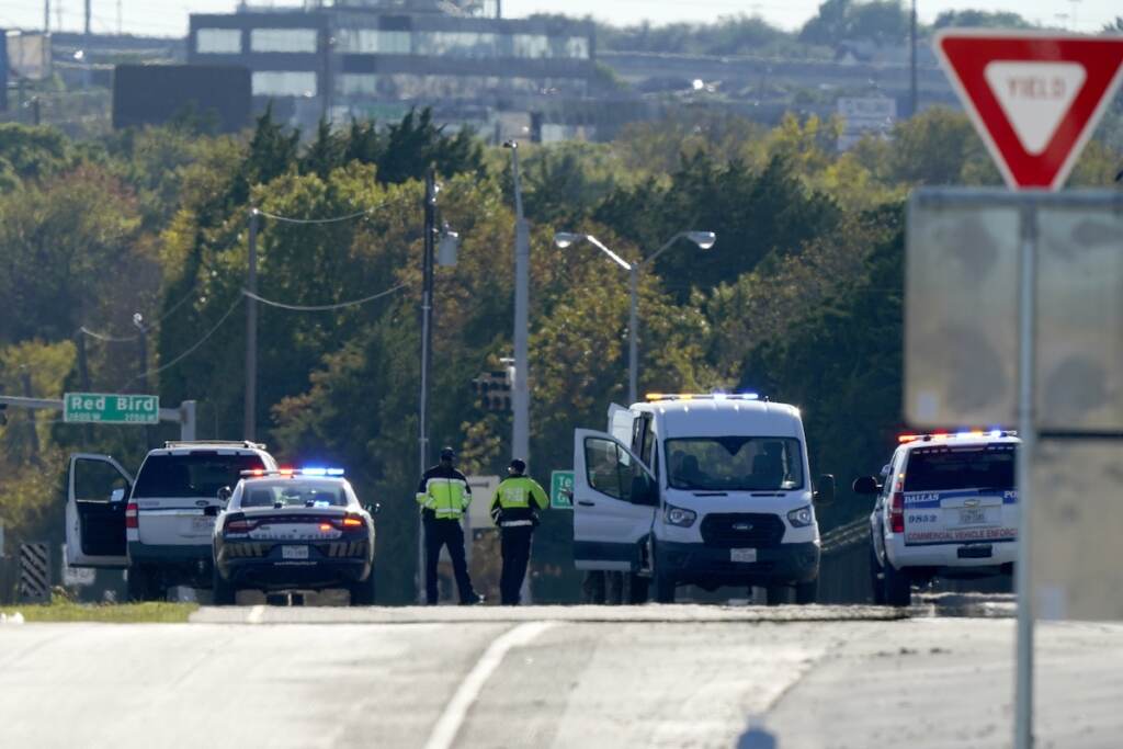Dallas Air Show Crash Emergency responders stage near Dallas Executive Airport where two historic military planes collided and crashed during an airshow, Saturday, Nov. 12, 2022. (AP Photo/LM Otero)
