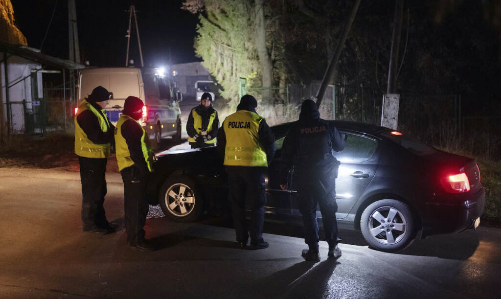 Poland Russia Ukraine War Police officers gather outside a grain depot in Przewodow, eastern Poland, on Tuesday Nov. 15, 2022 where the Polish Foreign Ministry said that a Russian-made missile fell and killed two people. (AP Photo)