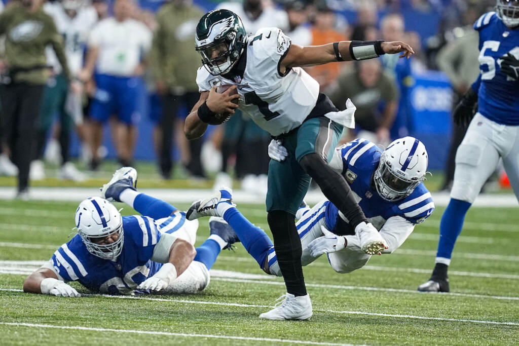 Eagles Colts Football Philadelphia Eagles quarterback Jalen Hurts (1) is pursued by Indianapolis Colts linebacker Zaire Franklin (44) in the second half of an NFL football game in Indianapolis, Fla., Sunday, Nov. 20, 2022. (AP Photo/Darron Cummings)