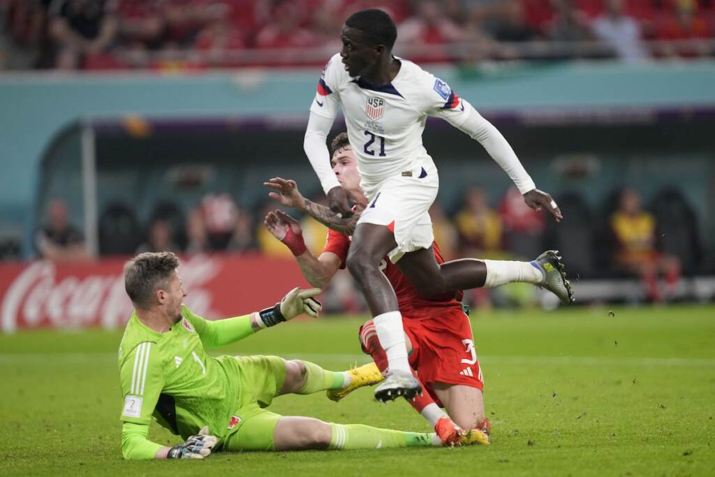 WCup US Wales Soccer Tim Weah of the United States scores during the World Cup, group B soccer match between the United States and Wales, at the Ahmad Bin Ali Stadium in in Doha, Qatar, Monday, Nov. 21, 2022. (AP Photo/Darko Vojinovic)