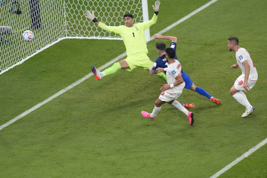 WCup Iran United States Soccer Christian Pulisic of the United States scores his side's opening goal during the World Cup group B soccer match between Iran and the United States at the Al Thumama Stadium in Doha, Qatar, Tuesday, Nov. 29, 2022. (AP Photo/Luca Bruno)