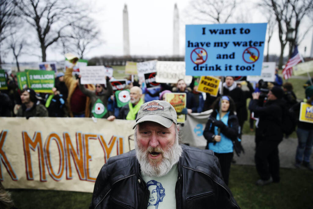 Wolf Inauguration Hydraulic fracturing opponents, including Ray Kemble of Dimock, Pa., front, demonstrate before Gov, -elect Tom Wolf takes the oath of office to become the 47th governor of Pennsylvania, Tuesday, Jan. 20, 2015, at the state Capitol in Harrisburg, Pa. (AP Photo/Matt Rourke)