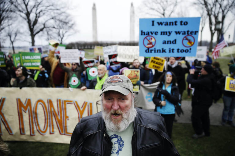 Hydraulic fracturing opponents, including Ray Kemble of Dimock, Pa., front, demonstrate before Gov, -elect Tom Wolf takes the oath of office to become the 47th governor of Pennsylvania, Tuesday, Jan. 20, 2015, at the state Capitol in Harrisburg, Pa. (AP Photo/Matt Rourke)