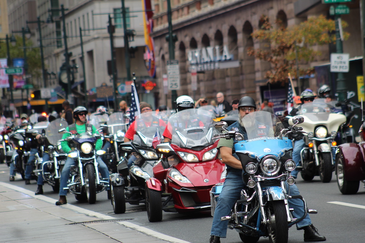 Bikers rode down Market Street on Nov. 6, 2022 to kick off the 2022 Philadelphia Veterans Parade. (Cory Sharber/WHYY)