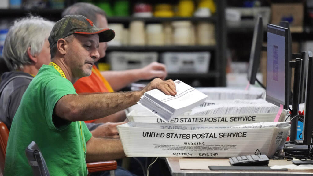 Election 2022 Pennsylvania A man scans a mail ballot.