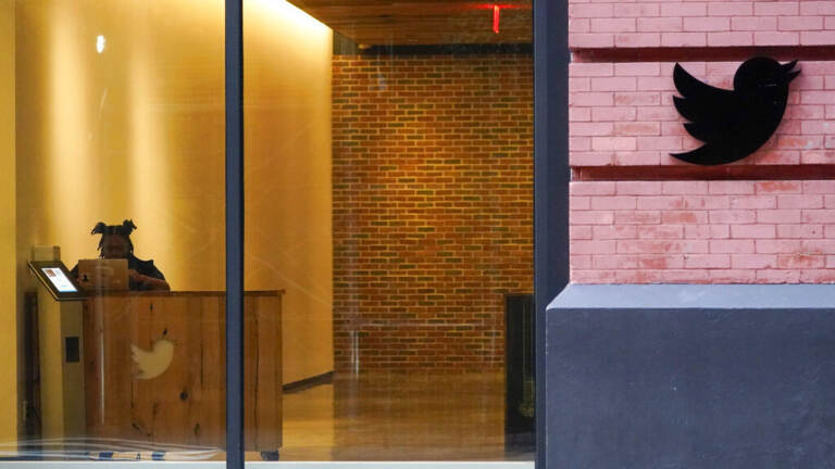 A receptionist works Oct. 26 in the lobby of the building that houses the Twitter office in New York. (Mary Altaffer/AP)