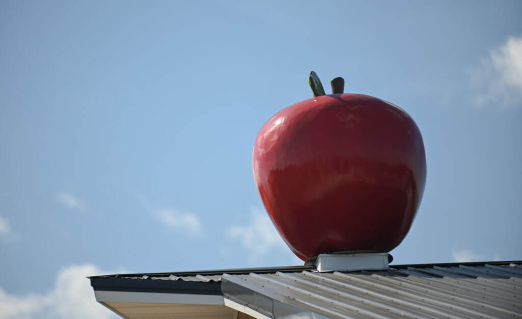 Maple Lawn Farms in York County on Sept. 20, 2022. A close-up of a red fake apple with blue sky visible in the background.