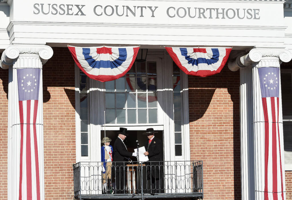 sussex.return.day Sussex County Sheriff Robert Lee, right, hands the election results to Georgetown Town Crier Kirk Lawson as Sussex County Return Day in 2018. (Delaware State News / Chuck Snyder)
