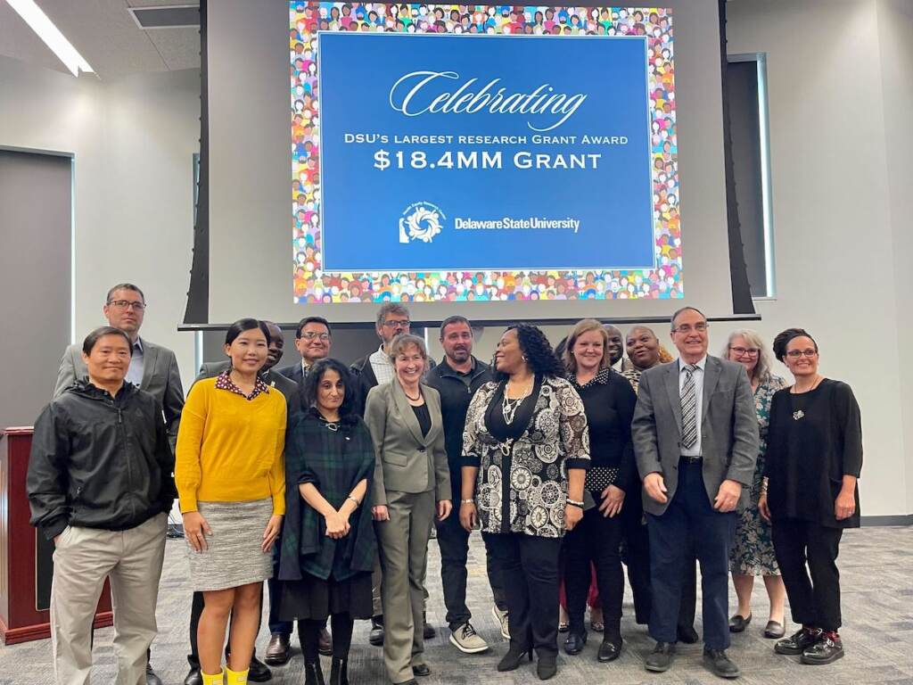 dsu-grant-health-equity People gather together and pose for a photo.
