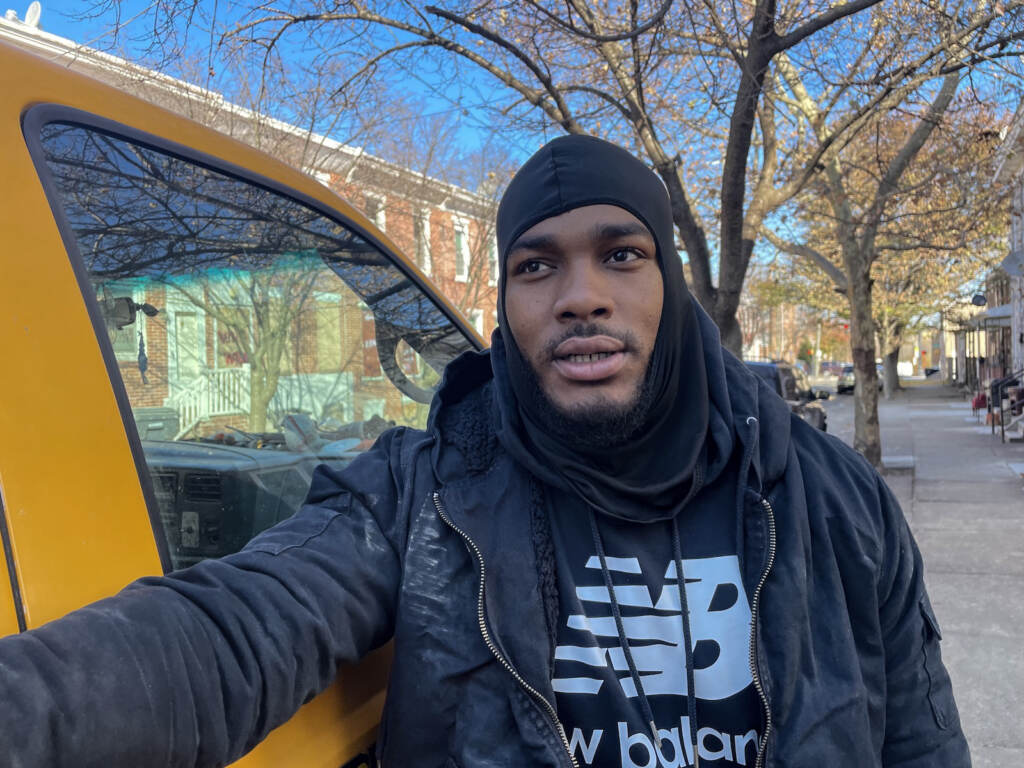 Martel McCain stands beside a vehicle on Wilmington's East Side