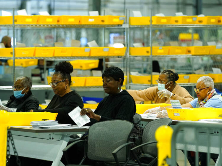 Election workers process mail-in-ballots for the midterm elections in Philadelphia, Tuesday, Nov. 8, 2022. (AP Photo/Matt Rourke)