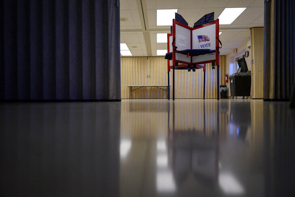 A Voting station is visible in an empty room in Pennsylvania.
