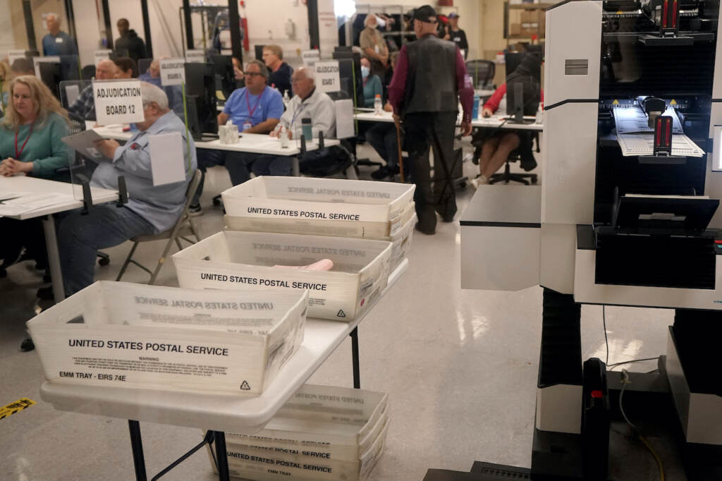 Election 2022 Arizona Adjudicators observe as ballots are tabulated inside the Maricopa County Recorders Office, Wednesday, Nov. 9, 2022, in Phoenix. (AP Photo/Matt York)