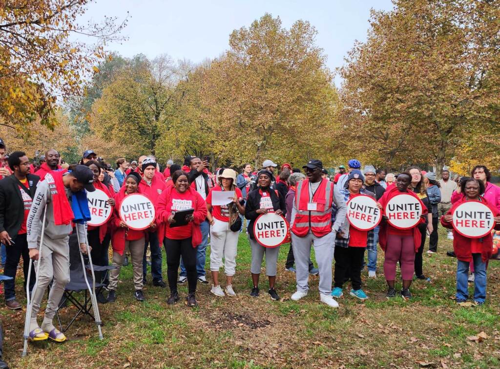 get-out-vote-philly-fdr-park-3 A group of people wearing red T-shirts pose with signs that read,