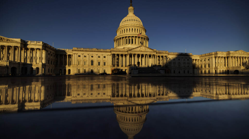 The Sun Rises Over Washington The Day After The Midterm Elections The U.S. Capitol at sundown.