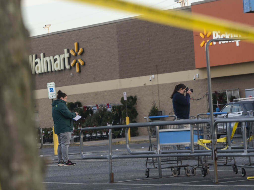 Members of the FBI investigate Tuesdays fatal shooting at the Chesapeake Walmart Supercenter on Wednesday in Chesapeake, Virginia. Six people, including the suspected gunman, are dead following. (Nathan Howard/Getty Images)