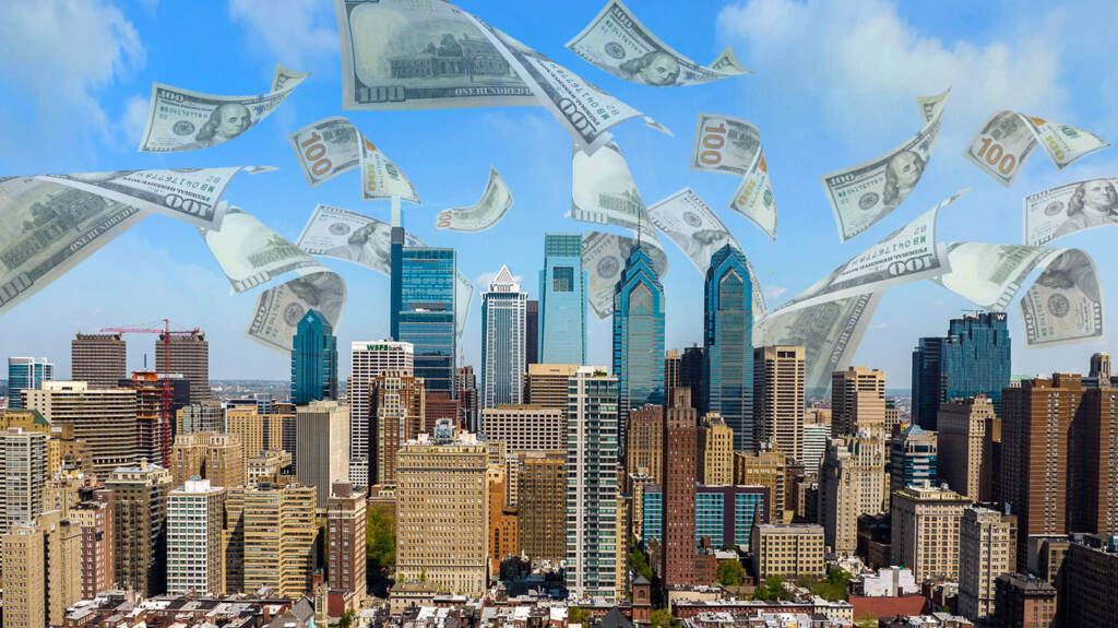 skyline-money-crop Money floats down from the sky over the skyline of Philadelphia.