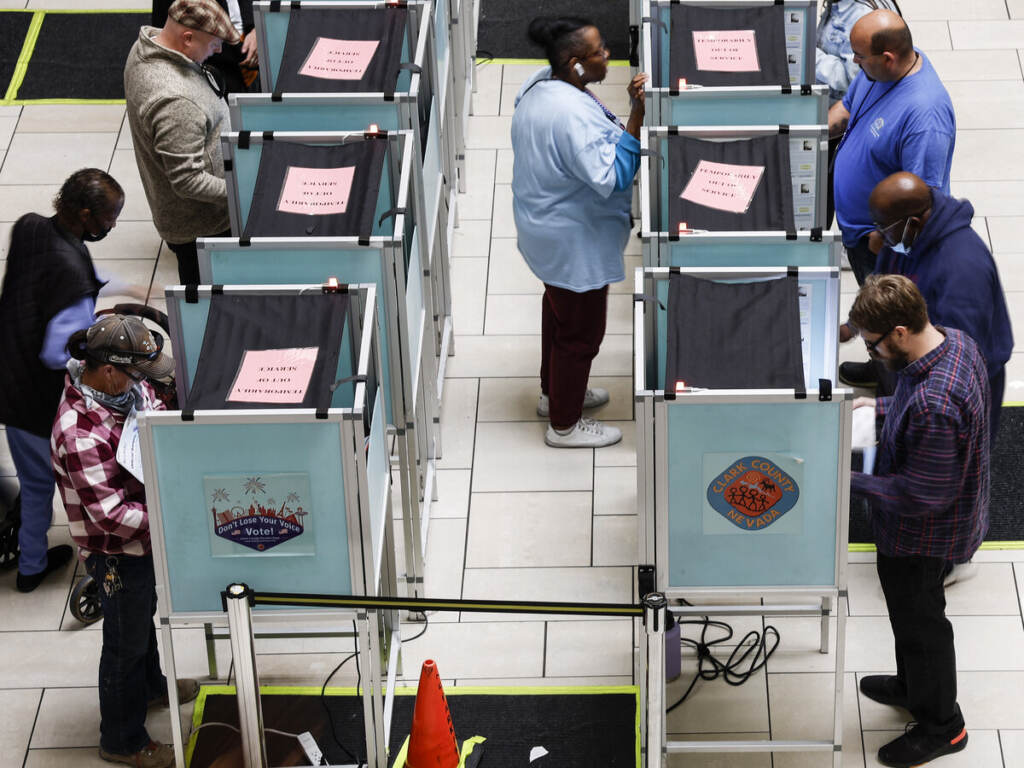 Americans Head To The Polls To Vote In The 2022 Midterm Elections Voters stand in voting booths as they fill out their ballots
