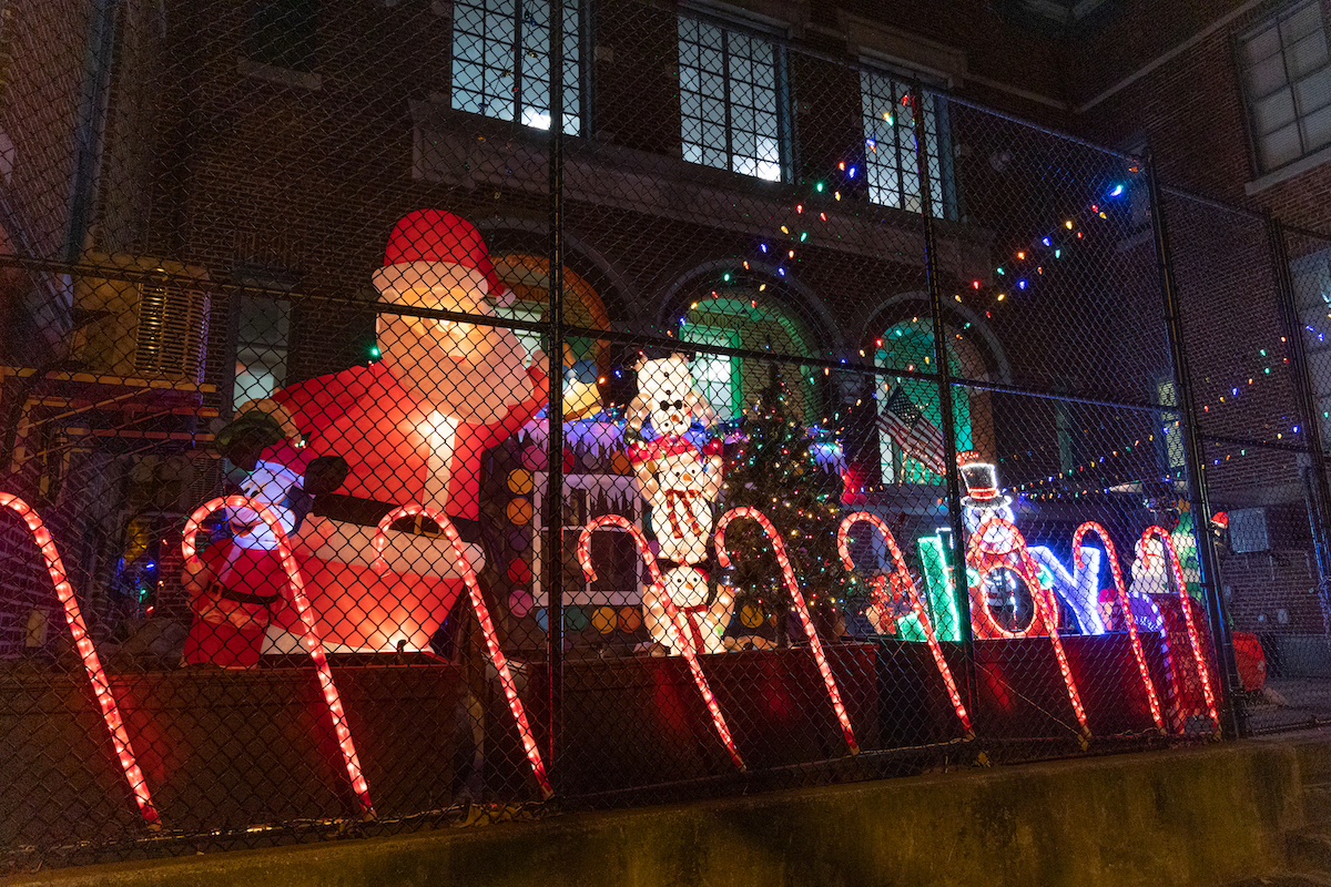 Blow-up characters and holiday lights are seen outside the Chandler School