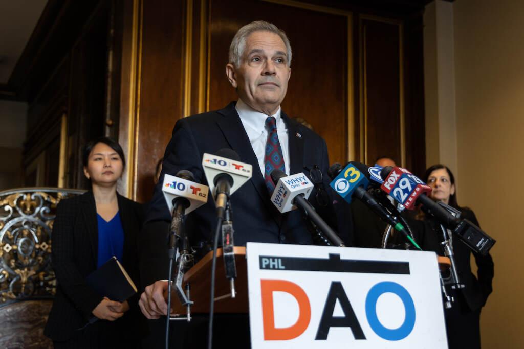 12 29 2022 k paynter larry krasner DAO presser carjacking enforcement unit_ DA Larry Krasner stands a podium.