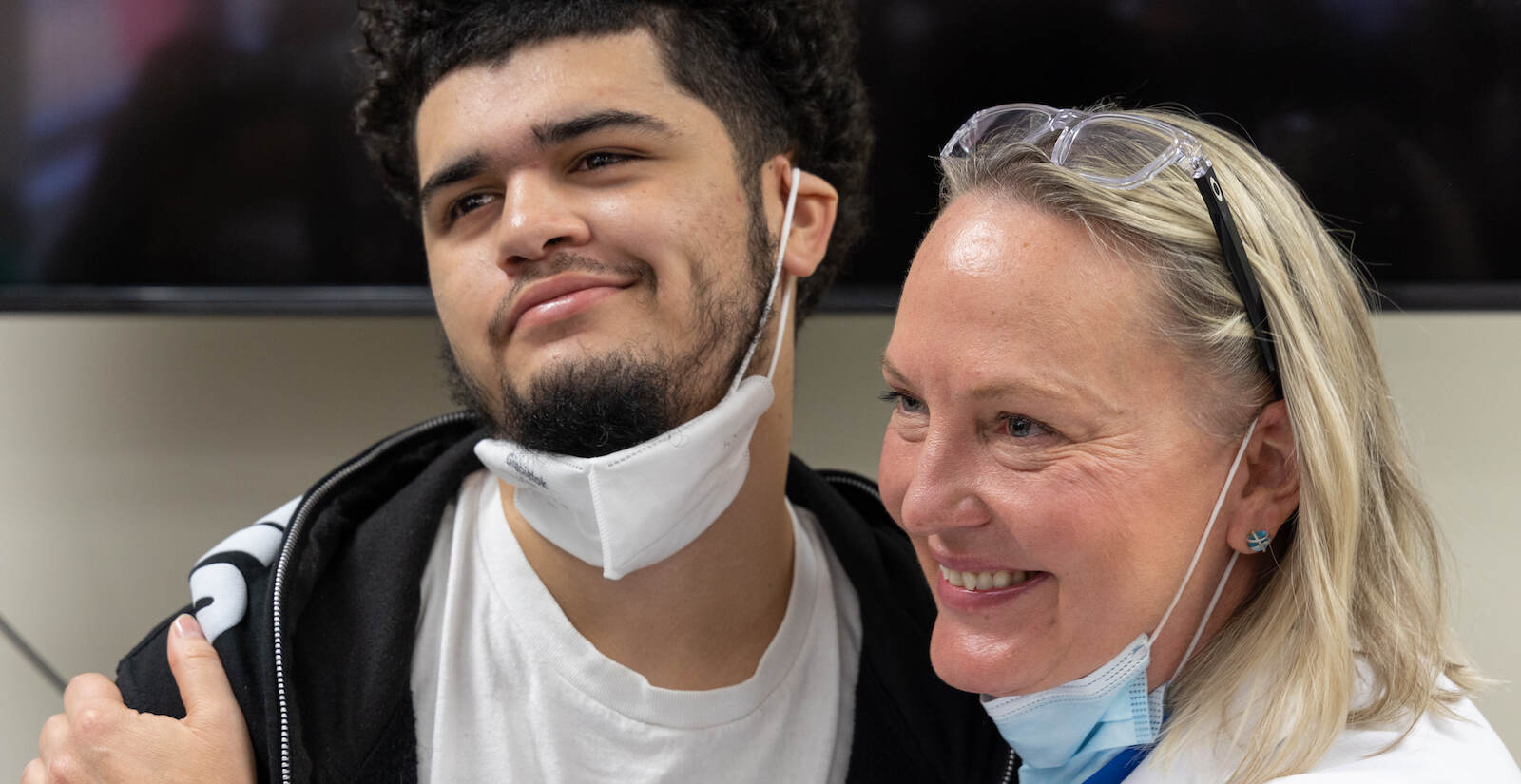 Dr. Tina Loven embrace Ivan, a gunshot survivor
