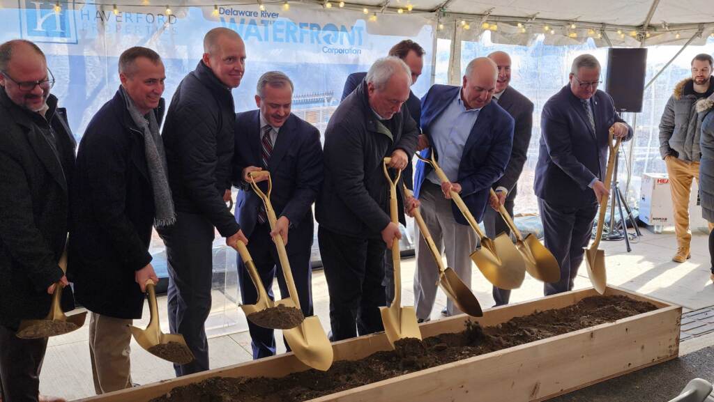 20221214_115059 Members of the development team break ground for the mixed-use Riverview at Festival Pier. (Tom MacDonald/WHYY)
