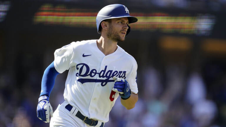 Los Angeles Dodgers' Trea Turner rounds first base after hitting a three-run home run during a baseball game against the Colorado Rockies Wednesday, Oct. 5, 2022, in Los Angeles. (AP Photo/Marcio Jose Sanchez)