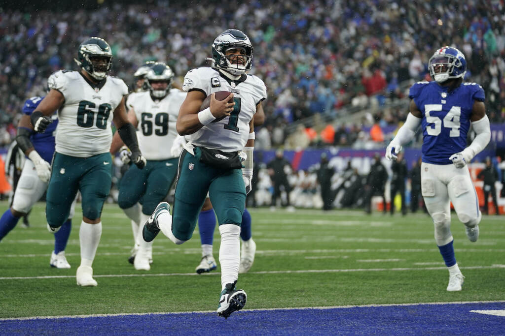 Eagles Giants Football Philadelphia Eagles quarterback Jalen Hurts (1) scores a touchdown against the New York Giants during the third quarter of an NFL football game, Sunday, Dec. 11, 2022, in East Rutherford, N.J. (AP Photo/Bryan Woolston)