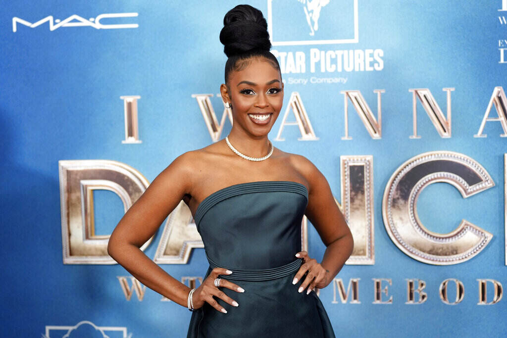 A woman poses on the red carpet.