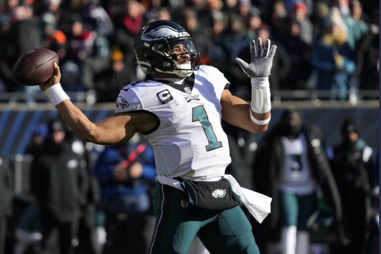 Philadelphia Eagles' Jalen Hurts passes during the first half of an NFL football game against the Chicago Bears, Sunday, Dec. 18, 2022, in Chicago. (AP Photo/Nam Y. Huh)