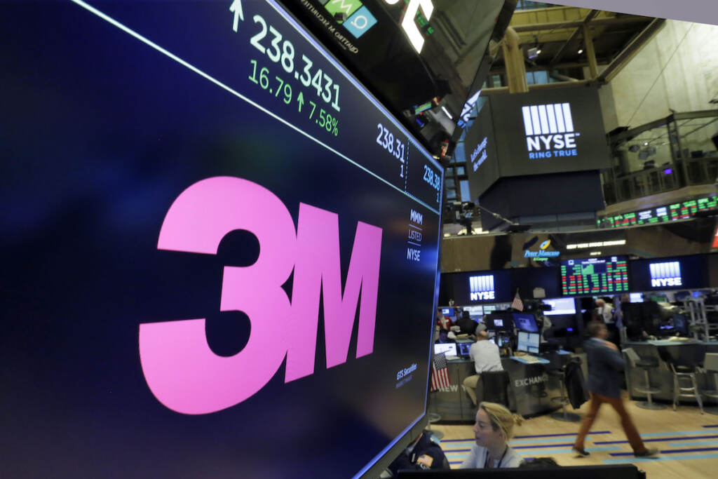 File photo: The logo for chemical and consumer products maker 3M appears on a screen above the trading floor of the New York Stock Exchange on Oct. 24, 2017. The company said Tuesday, Dec. 20, 2022, that it will phase out manufacturing of “forever chemicals” and try to get them out of all their products by the end of 2025. (AP Photo/Richard Drew, File)