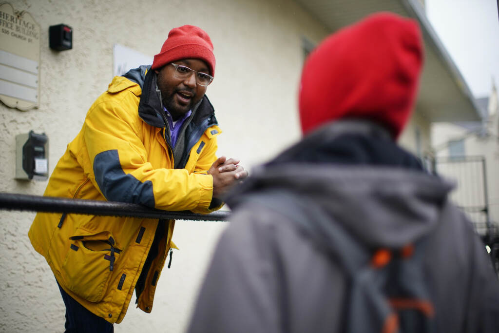 Redistricting Pennsylvania Greg Scott, a newly-elected Democratic member of Pennsylvania's House of Representatives, speaks with a person outside the Hospitality Center which helps people experiencing homelessness and poverty, in Norristown, Pa., Thursday, Dec. 22, 2022. (AP Photo/Matt Rourke)