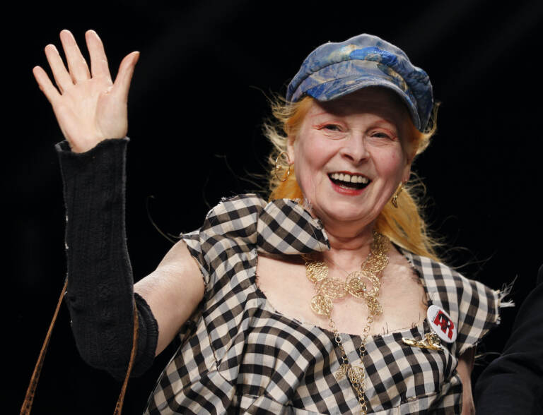 File photo: British fashion designer Vivienne Westwood waves to the audience after presenting the Vivienne Westwood fashion collection from the men's Spring/Summer 2013 collection, part of the Milan Fashion Week, unveiled in Milan,  June 24, 2012. (AP Photo/Luca Bruno, File)
