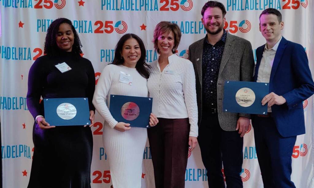 IMG20221214152114 rev cr Danielle Smith of Smith Memorial Playground, artist Michelle Angela Ortiz of Our Market, and Chase Trimmer and Nate Garland of Pennsylvania Special Olympics. (Peter Crimmins /WHYY)